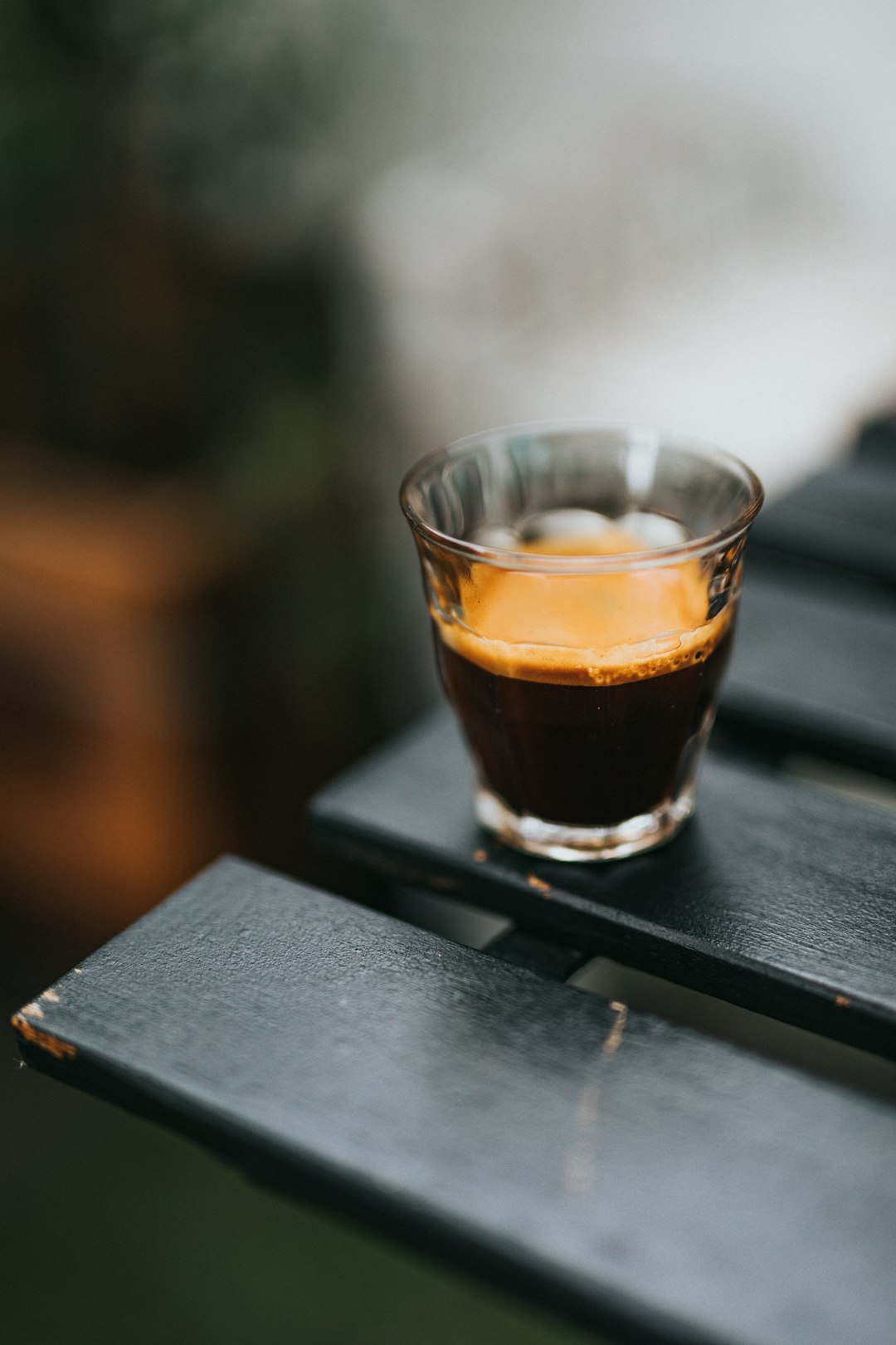 clear-drinking-glass-with-brown-liquid-on-black-table-qxl6r8-bq-4